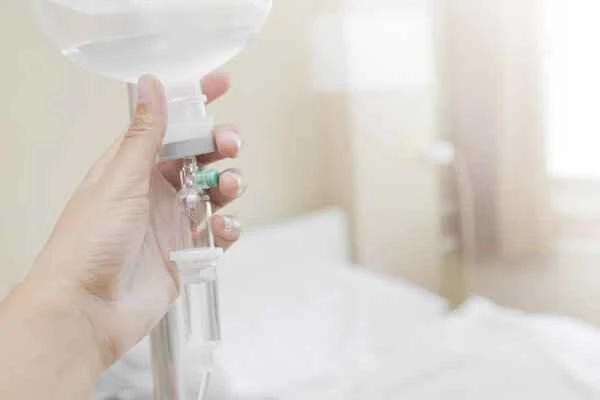 Can intravenous infusion for intestinal obstruction cause abdominal pain?